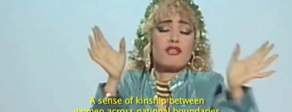 Woman with hands up with captions that say "a sense of kinship between woman across national boundaries"