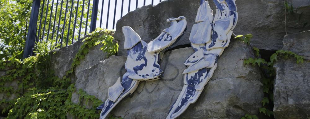 Ceramics on wall with blue and white designs 