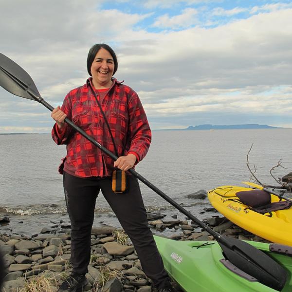 photo of  Lisa Myers holding kayak paddle 