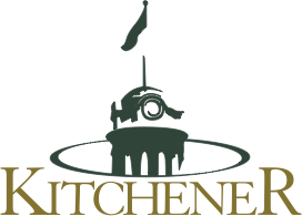 City of Kitchener logo. Top of a tower with a dome and clock, and a very tall flag.