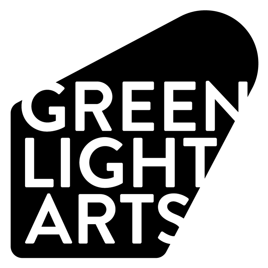 A spotlight shaped splash of black which is highlighting white text saying Green Light Arts