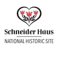 A heart with three red flowers in it above text that says Schneider Haus National Historic Site